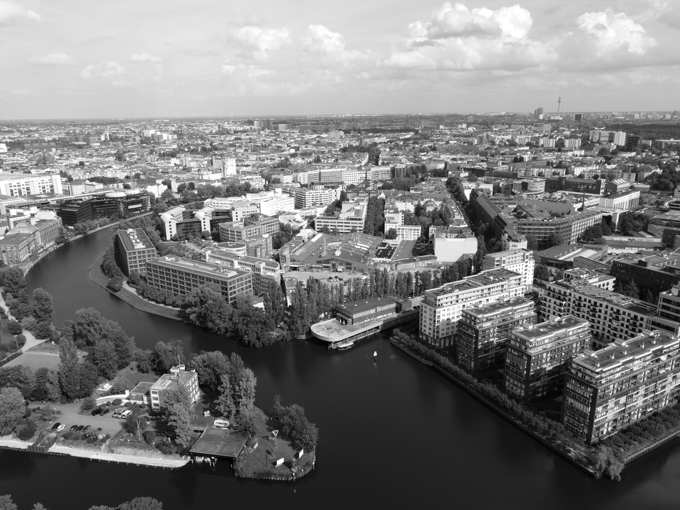 Drone view across the Spree towards the city centre and the TV tower, the site in the middle